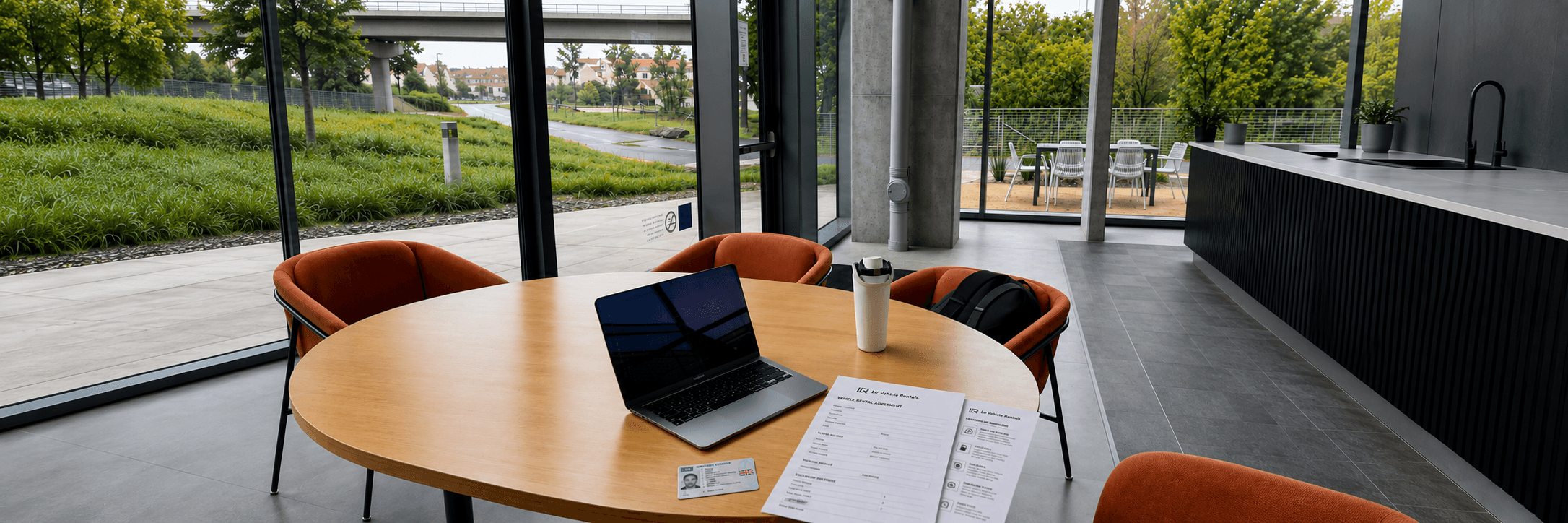 A driving licence and rental paperwork on a desk